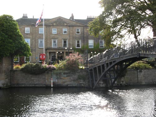 Accessible only by a picturesque iron footbridge